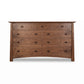 Cherry Moon 9-Drawer Dresser by Maple Corner Woodworks, handcrafted in Vermont with natural walnut wood, and an eco-friendly finish for a luxurious and sustainable bedroom centerpiece.