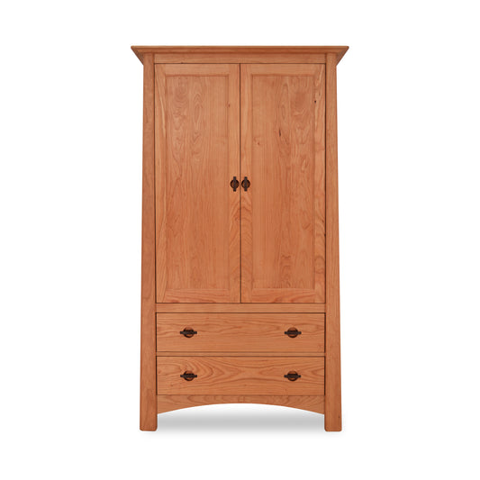 A solid hardwood Maple Corner Woodworks Cherry Moon Armoire with two doors above and two drawers below, isolated on a white background.