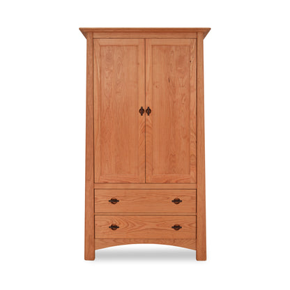 A Maple Corner Woodworks Cherry Moon Armoire, with two doors above and two drawers below, all made from solid hardwood construction, against a white background.
