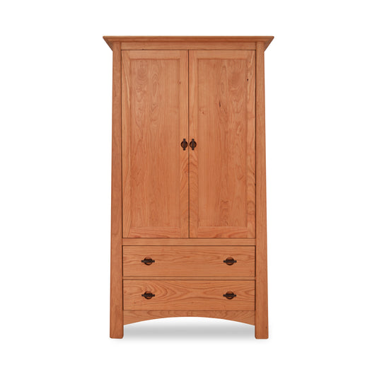 Cherry Moon Armoire by Maple Corner Woodworks with solid hardwood construction, two doors, two drawers, and black metal handles.
