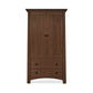 A Maple Corner Woodworks Cherry Moon Armoire with two doors and a lower drawer, showcasing Vermont craftsmanship and solid hardwood construction, set against a white background.