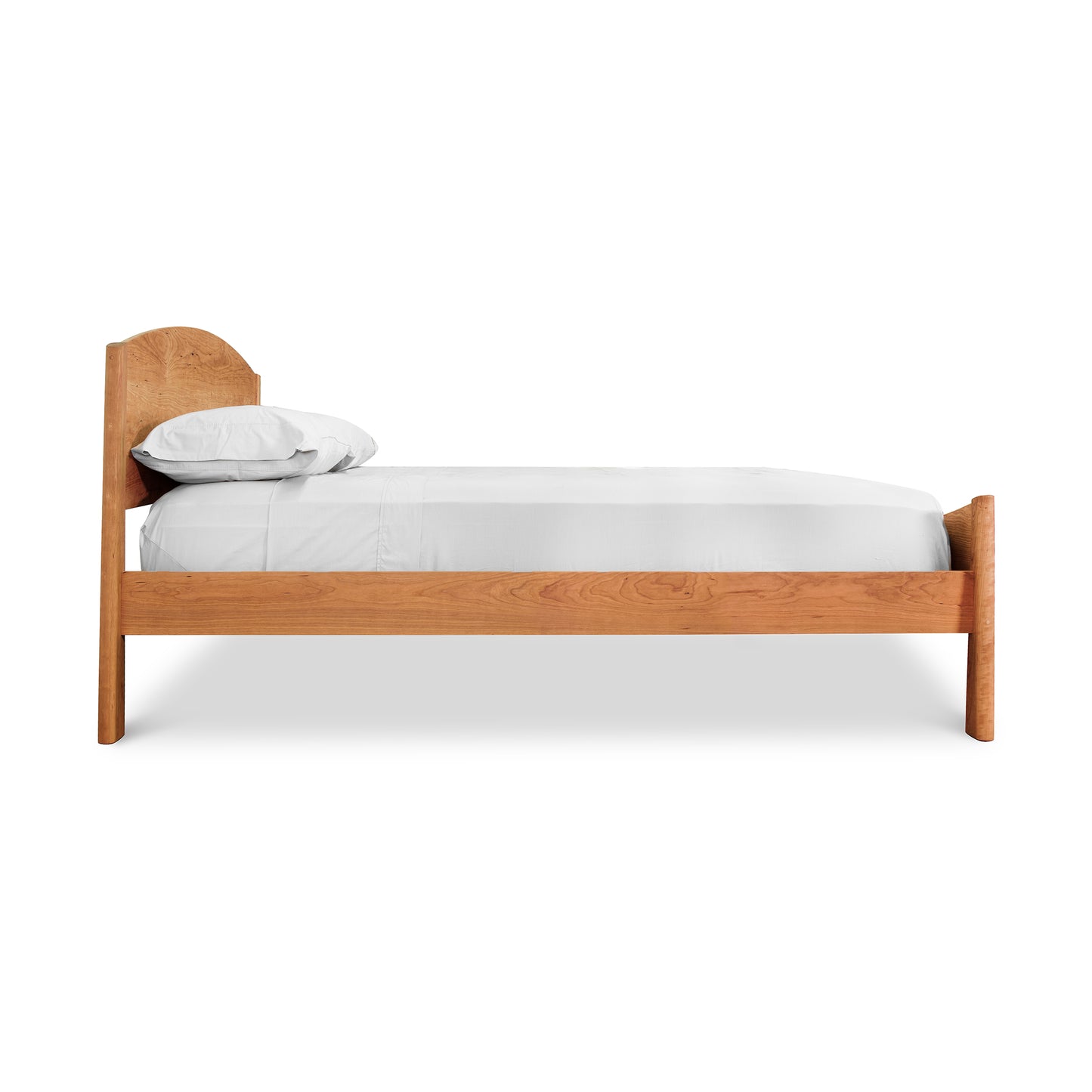 A handmade Maple Corner Woodworks Cherry Moon Bed - Queen - Ready to Ship with a wooden headboard and footboard.