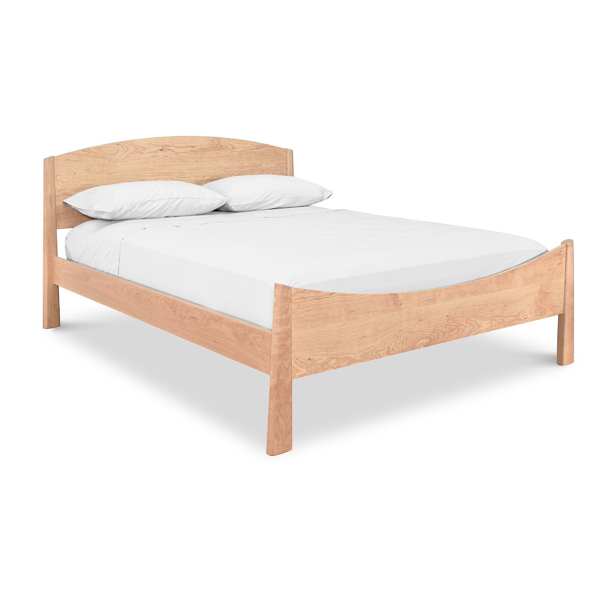 A minimalist Maple Corner Woodworks Cherry Moon Bed frame with a headboard, crafted from sustainably harvested woods, featuring crisp white bedding and two pillows, isolated on a plain white background.