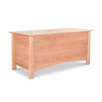 Cherry Moon Blanket Chest highlighting Vermont craftsmanship, crafted from luxurious American hardwoods with a smooth surface, solid front panel, and gracefully curved wooden legs.