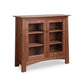 Cherry Moon Bookcase by Maple Corner Woodworks, handcrafted in Vermont from sustainable walnut with glass doors, elegant and durable statement piece.