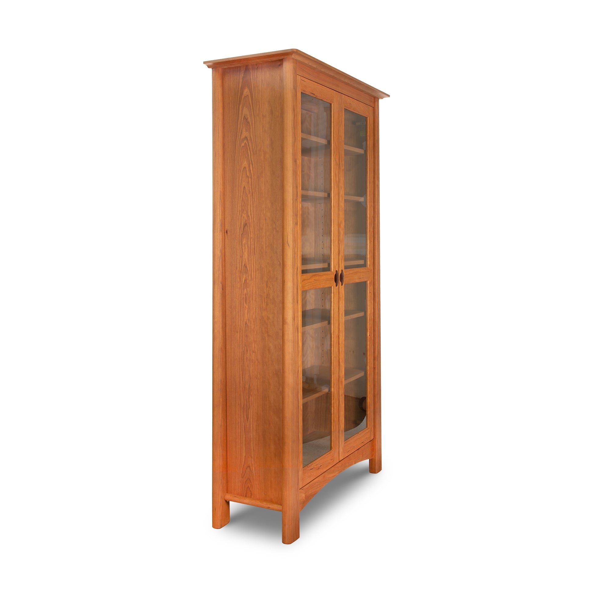 Cherry Moon Bookcase by Maple Corner Woodworks, crafted in Vermont from sustainable hardwood, featuring glass doors and black handles.