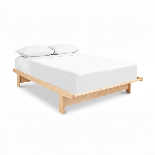 Cherry Moon Dovetail Platform Bed by Maple Corner Woodworks featuring a white mattress and pillows, showcasing expert Vermont craftsmanship.