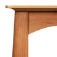 Cherry Moon End Table by Maple Corner Woodworks, handcrafted in Vermont from solid cherry hardwood, with a focus on the table’s unique leg and edge details.
