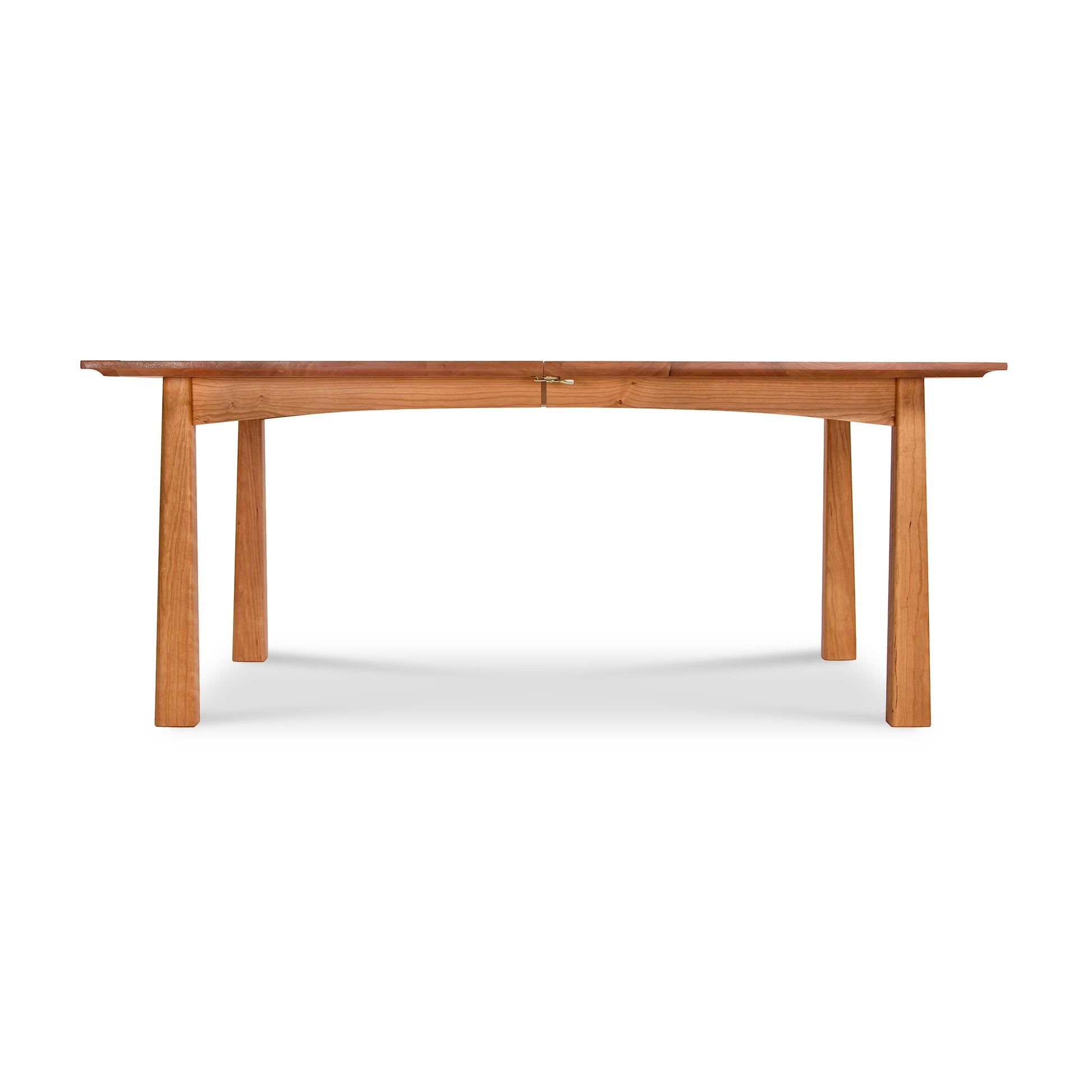 A simple natural Cherry Moon Extension Dining Table with a straight top and four sturdy legs, photographed against a white background by Maple Corner Woodworks.