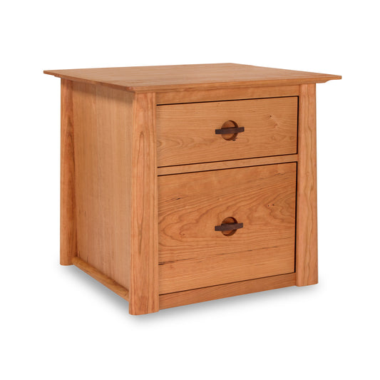 A Cherry Moon file cabinet with two drawers, made from hardwood and featuring walnut pulls, by Maple Corner Woodworks.