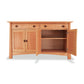 The Cherry Moon Large Sideboard-Buffet from Maple Corner Woodworks is a high-end dining room piece made from sustainable hardwoods. It features two doors and two drawers, providing ample storage space for all your dining needs.
