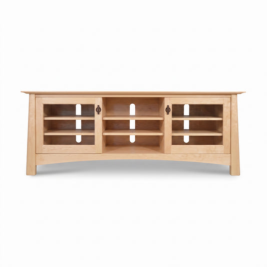 Cherry Moon 68″ TV console by Maple Corner Woodworks in light cherry wood with two glass cabinets, three open shelves, and built-in cord management.