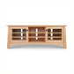 Cherry Moon 68" TV console by Maple Corner Woodworks with glass-door cabinets and open shelves, handcrafted in solid cherry for stylish, American made media storage.