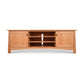 A Cherry Moon 80" TV-Media Console by Maple Corner Woodworks, with shelves and drawers, also serving as a TV console.