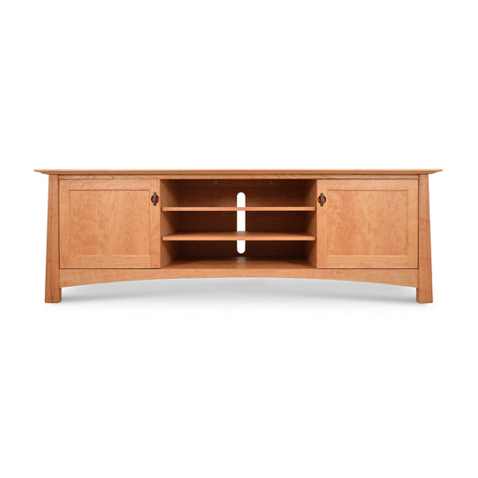 A long, curved Maple Corner Woodworks Cherry Moon 80" TV-Media Console with open central shelves and closed cabinets on each side, set against a white background.