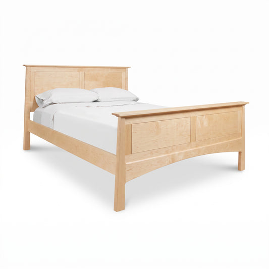 Maple Corner Woodworks Cherry Moon Panel Bed features elegant panel design and light cherry finish, shown with white bedding and two pillows.