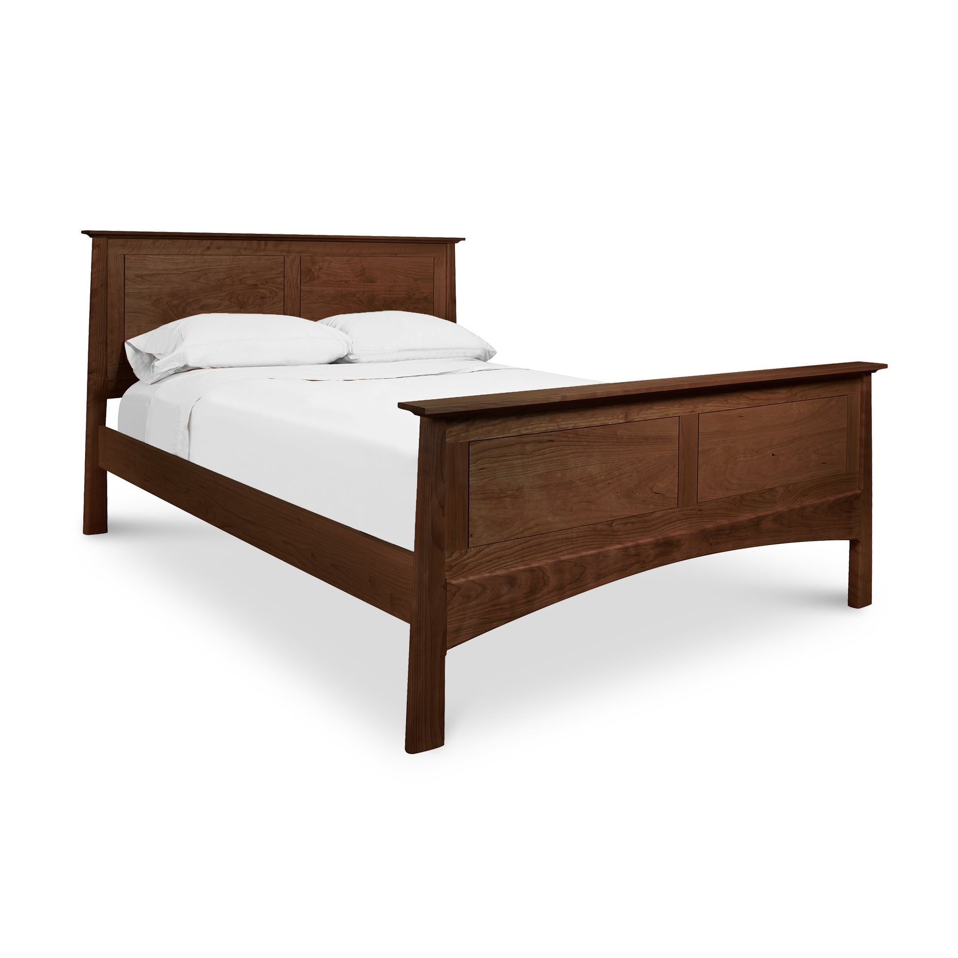 A Maple Corner Woodworks Cherry Moon Panel Bed with a prominent headboard and footboard, finished in natural cherry, set against a white background. The bed is made with white bedding.