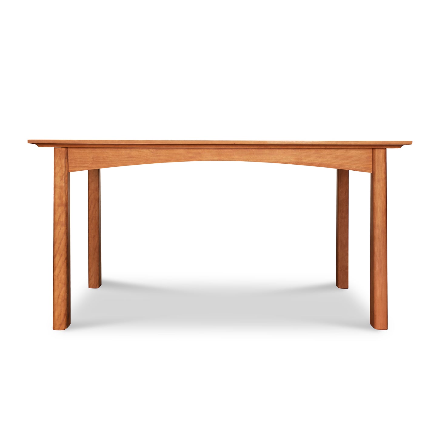 A simple Cherry Moon Solid Top Dining Table with a smooth rectangular top and four sturdy legs, set against a plain white background. The table’s natural cherry wood from Maple Corner Woodworks appears polished and reflects light softly.