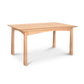 A simple Cherry Moon Solid Top Dining Table from Maple Corner Woodworks with a smooth top and four sturdy legs, isolated on a white background. The table's natural wood grain is visible, giving it a classic look.