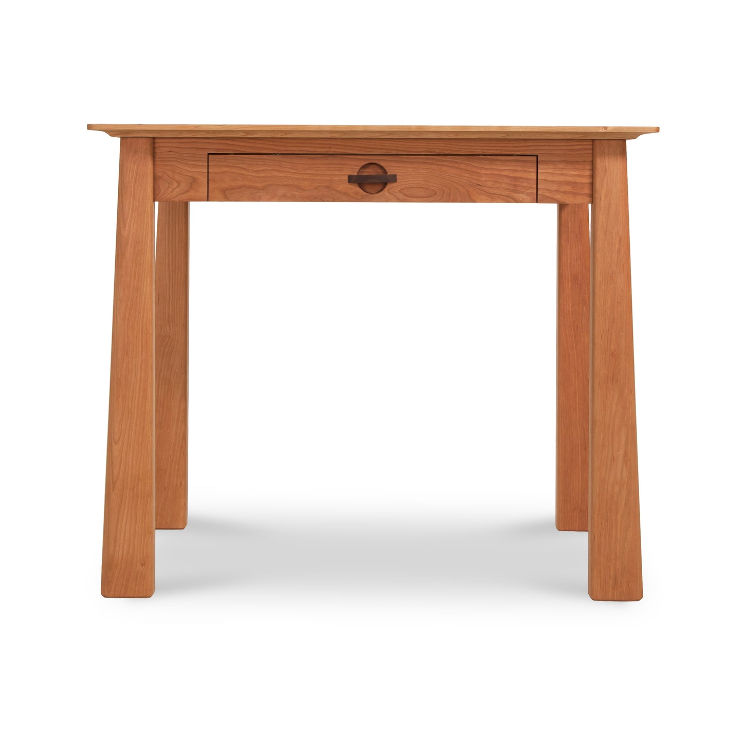 The Maple Corner Woodworks Cherry Moon Writing Desk is made from sustainably harvested premium hardwoods and showcases a natural finish. It includes a central drawer with a metal handle and features an eco-friendly, simple, sturdy design with four straight legs.