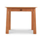 Cherry Moon Writing Desk by Maple Corner Woodworks, showcasing solid wood craftsmanship with a central drawer, simple handle, and straight legs.