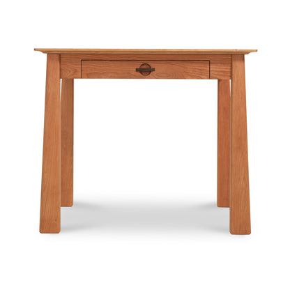 Cherry Moon Writing Desk by Maple Corner Woodworks, showcasing solid wood craftsmanship with a central drawer, simple handle, and straight legs.