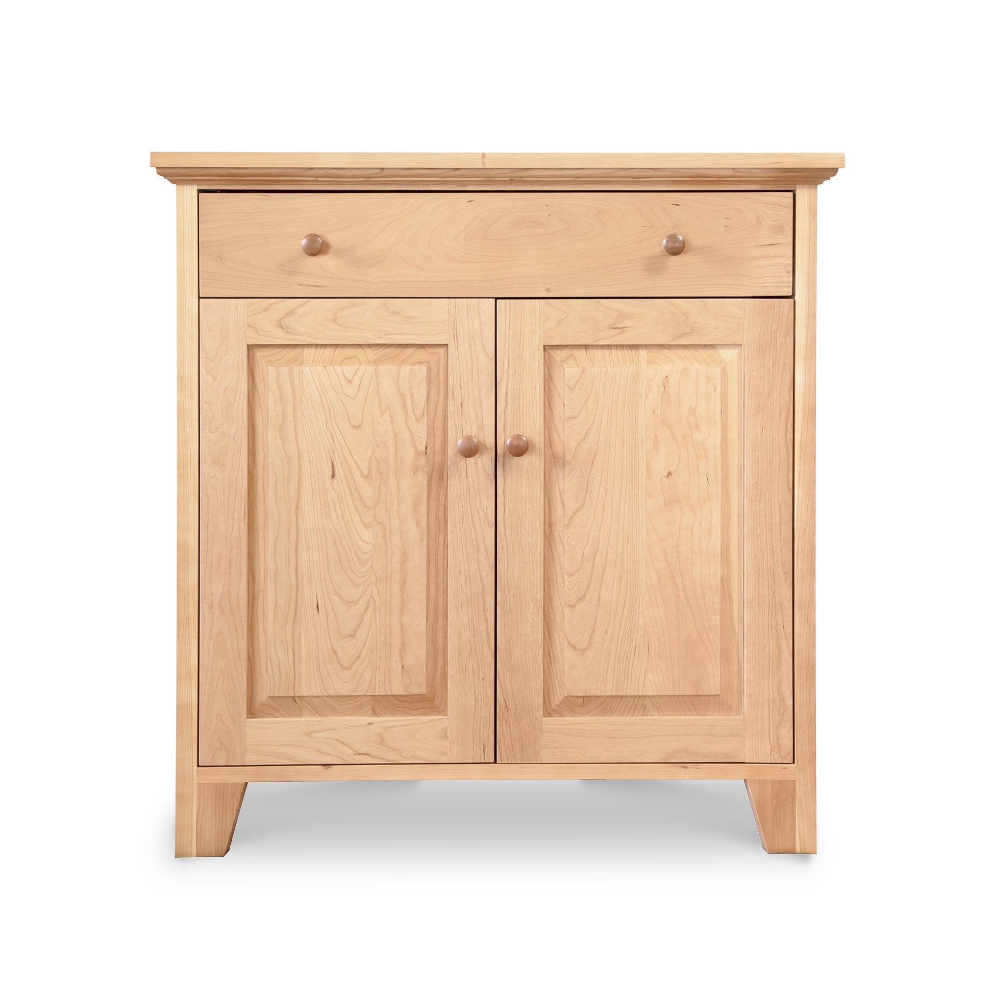 Classic Country Buffet by Lyndon Furniture featuring a light-finished wooden cabinet with one top drawer and two paneled doors with round knobs.