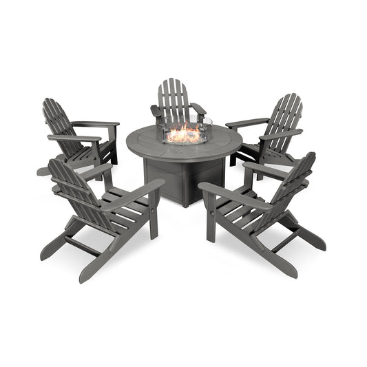 An outdoor furniture set featuring four dark gray POLYWOOD Adirondack chairs around a circular fire pit table, set against an isolated white background.