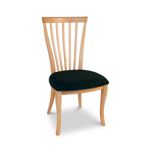 A wooden chair with a black seat.