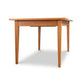 A Classic Shaker Butterfly Extension Table - Floor Model by Lyndon Furniture with a natural cherry top and legs.