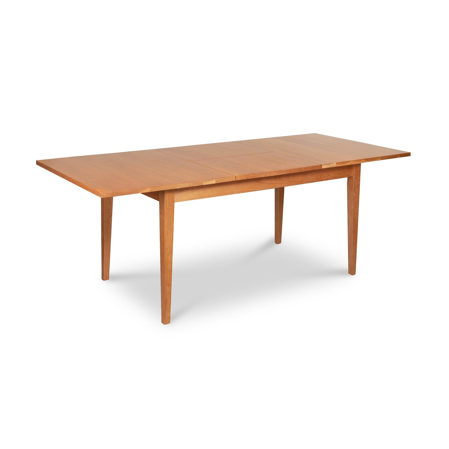 A Classic Shaker Butterfly Extension Table - Floor Model by Lyndon Furniture with a natural cherry wooden top.