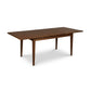 A Classic Shaker Butterfly Extension Table by Lyndon Furniture with a hardwood top and legs.