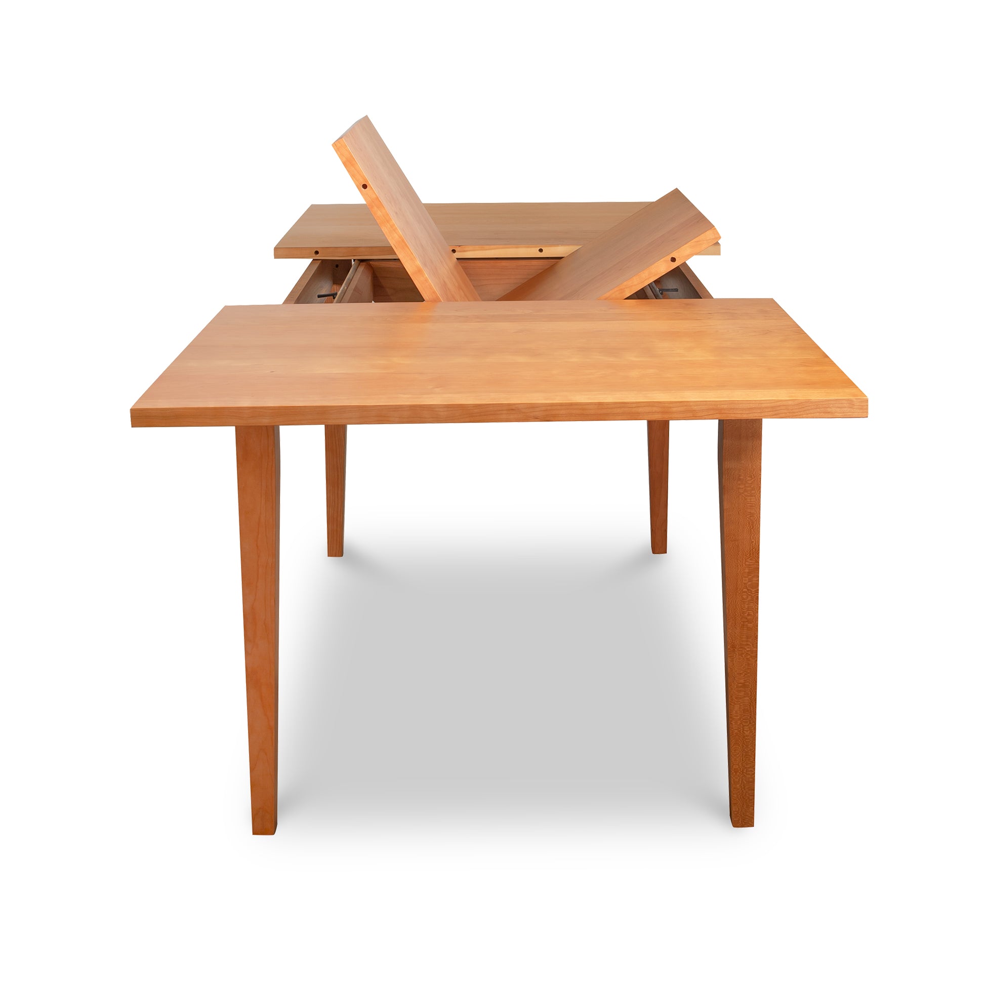 A handcrafted, natural cherry, mid-century modern Classic Shaker Butterfly Extension Table - Floor Model with a folding top by Lyndon Furniture.