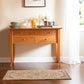 Lyndon Furniture Classic Shaker Flare Leg 48″ Hunt Board, handcrafted in Vermont, beautifully showcases quality craftsmanship and elegant design.