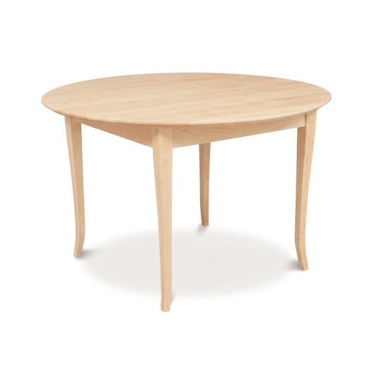 Lyndon Furniture Classic Shaker Flare Leg Round Solid Top Table crafted from solid hardwoods, showcasing elegant curves and expert craftsmanship.