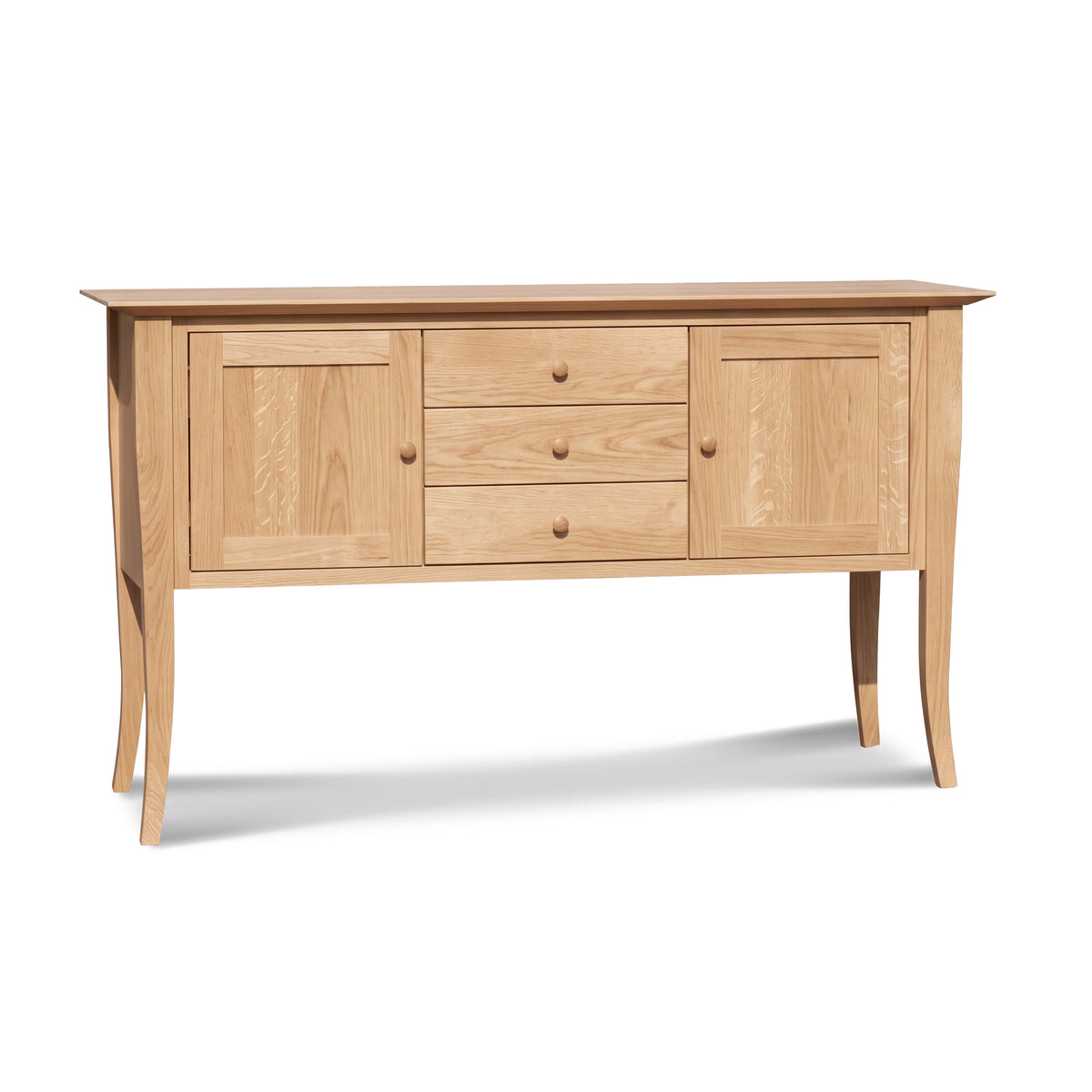 Classic Shaker Flare Leg Small Buffet by Lyndon Furniture, crafted in solid hardwood with two doors, three drawers, and graceful curved legs.