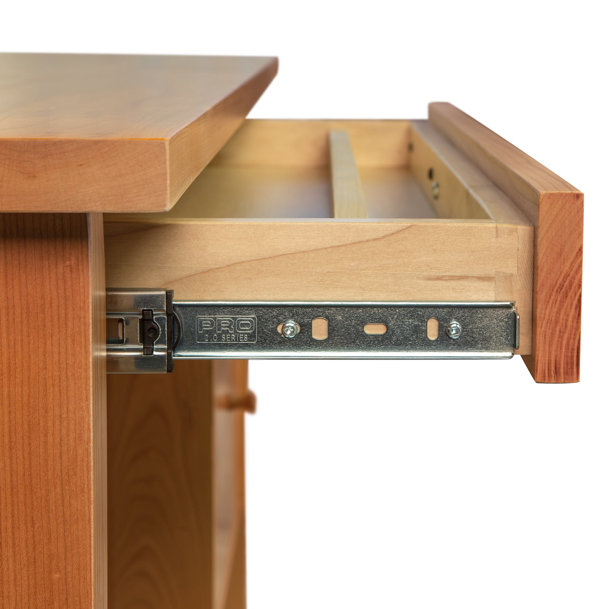 Close-up of a solid wood drawer partially pulled out, highlighting the metal drawer slide mechanism labeled "PRO" with screw holes. The light, natural finish enhances the American made craftsmanship of Lyndon Furniture's Small Wood Flare Leg Executive Desk. Perfect match for cherry, walnut, maple furniture enthusiasts.