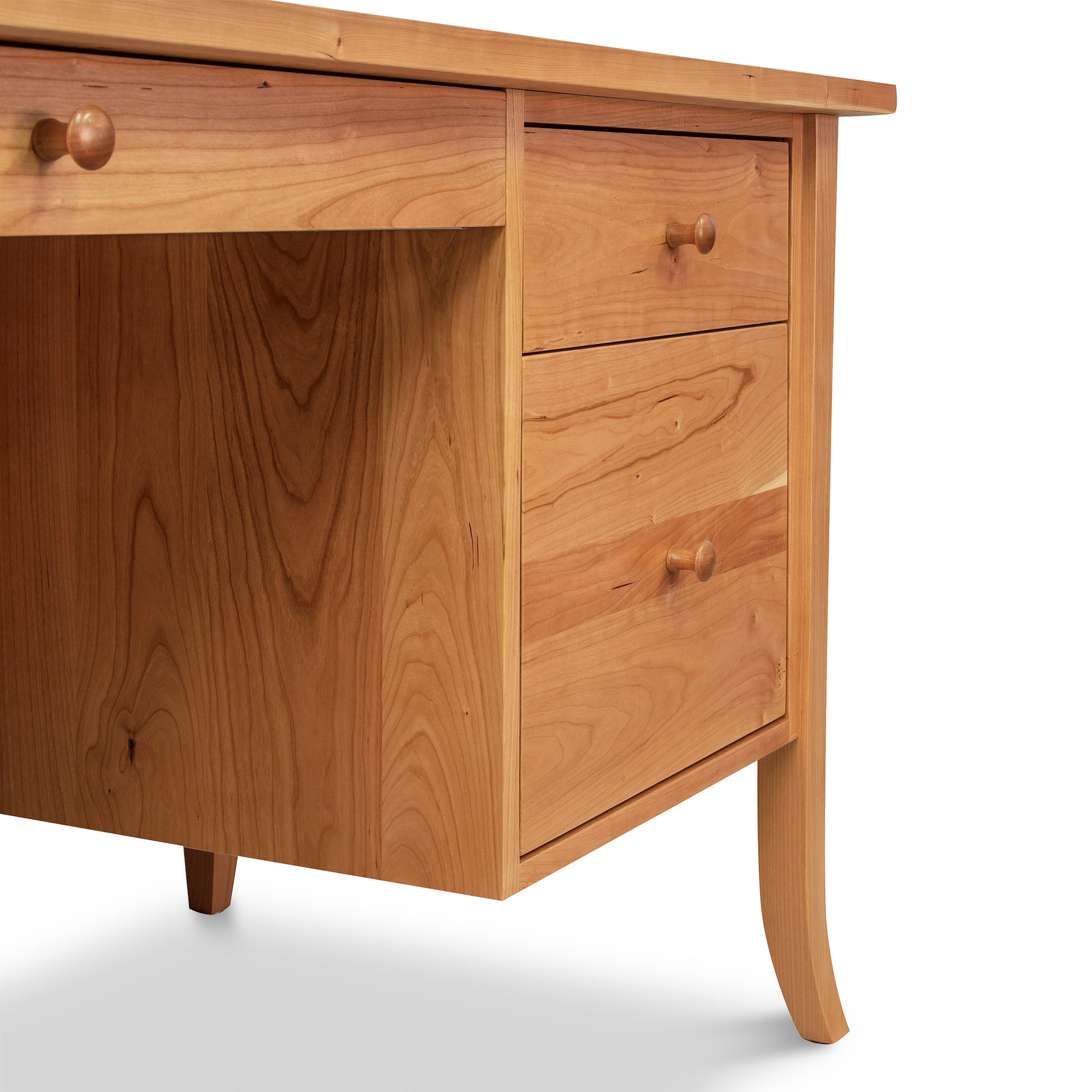 Lyndon Furniture Small Wood Flare Leg Executive Desk featuring two drawers with round knobs and detailed natural wood grain.