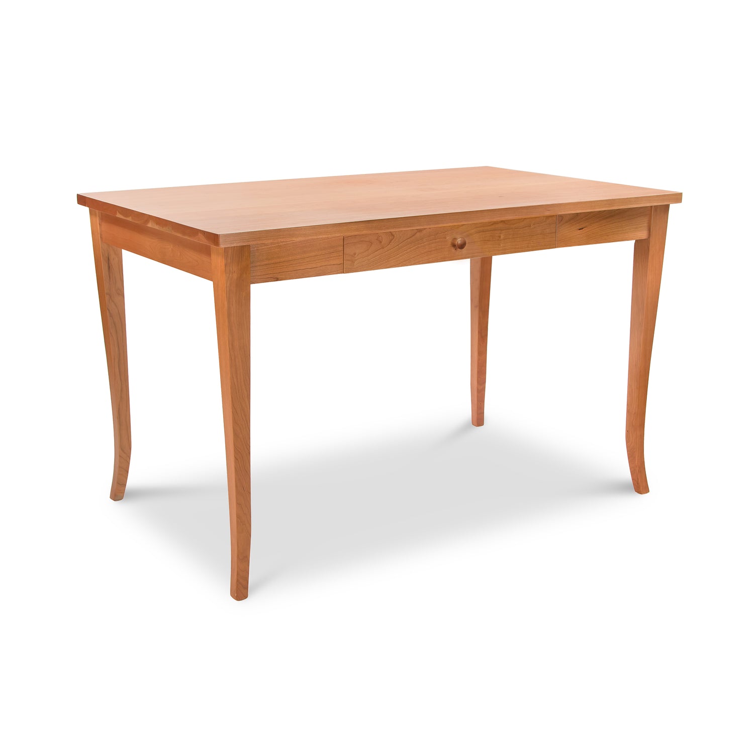 The Classic Shaker Flare Leg Writing Desk by Lyndon Furniture features a rectangular top with four slightly curved legs, embodying the timeless Classic Shaker style. Crafted from natural solid wood with a light finish, it boasts a single drawer centered on one of the long sides. This eco-friendly writing desk is presented against a plain, white background.