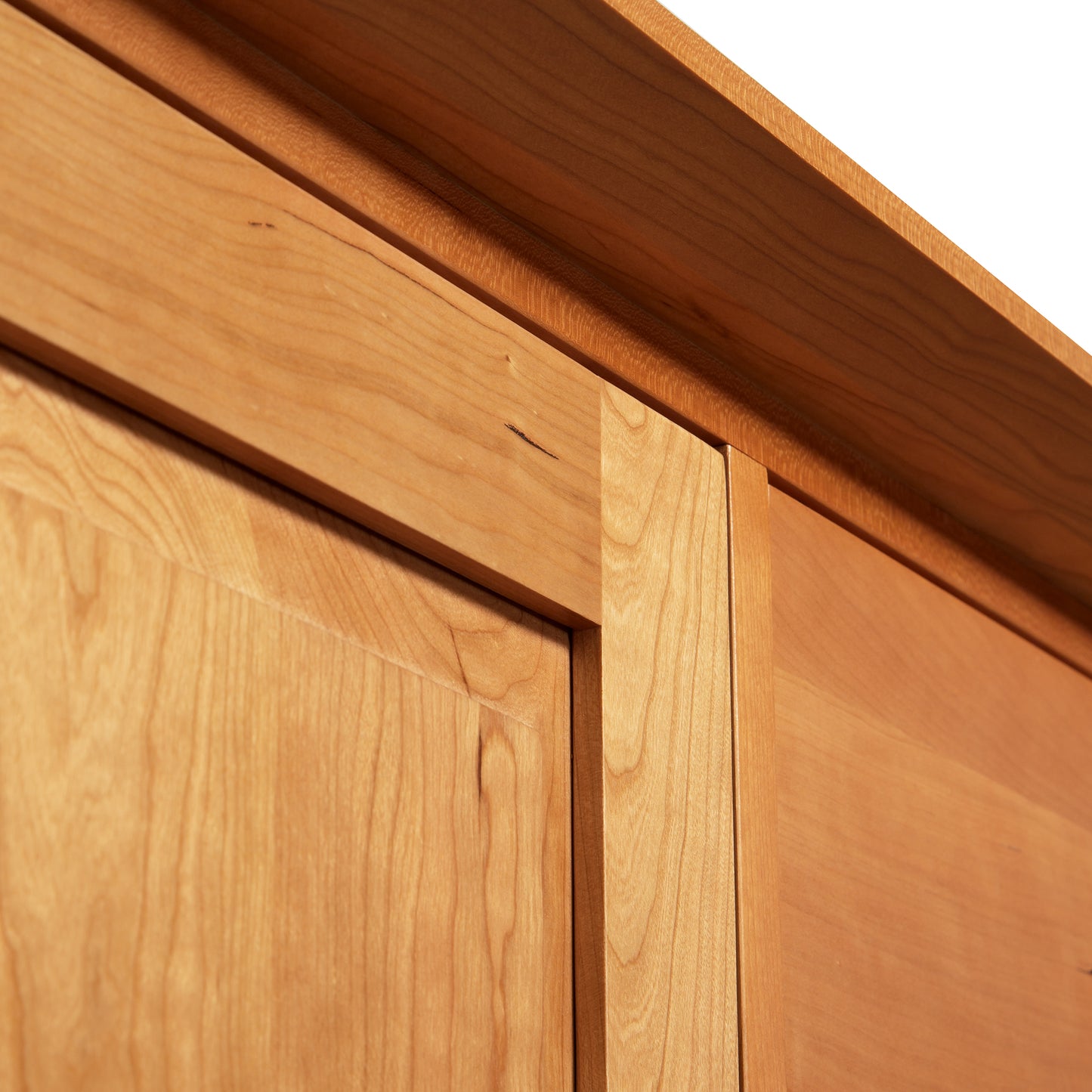 A close up view of a handmade wooden cabinet door in Lyndon Furniture's Classic Shaker Large Buffet Style.