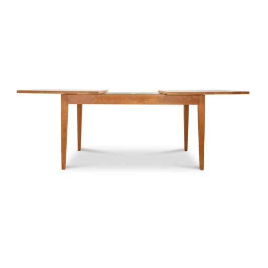 Lyndon Furniture Classic Shaker Extension Dining Table, handcrafted in solid wood with leaves, showcasing timeless American design.
