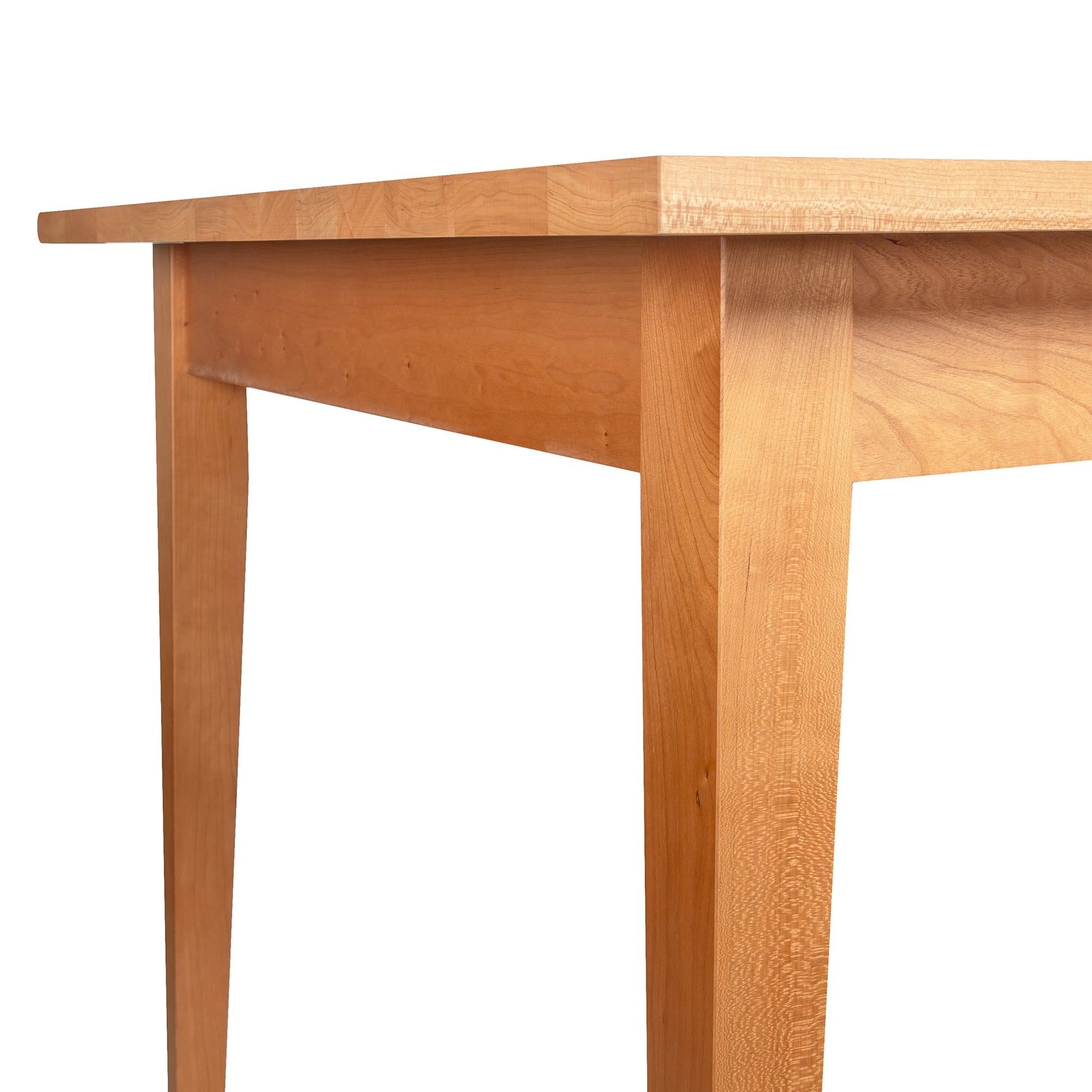 Close-up of the Lyndon Furniture Classic Shaker Solid Top Dining Table highlighting the handcrafted solid wood edge and sturdy legs.