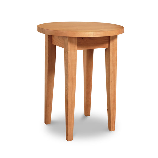 Classic Shaker round end table by Lyndon Furniture, crafted from sustainable wood with a smooth round top and four straight legs.