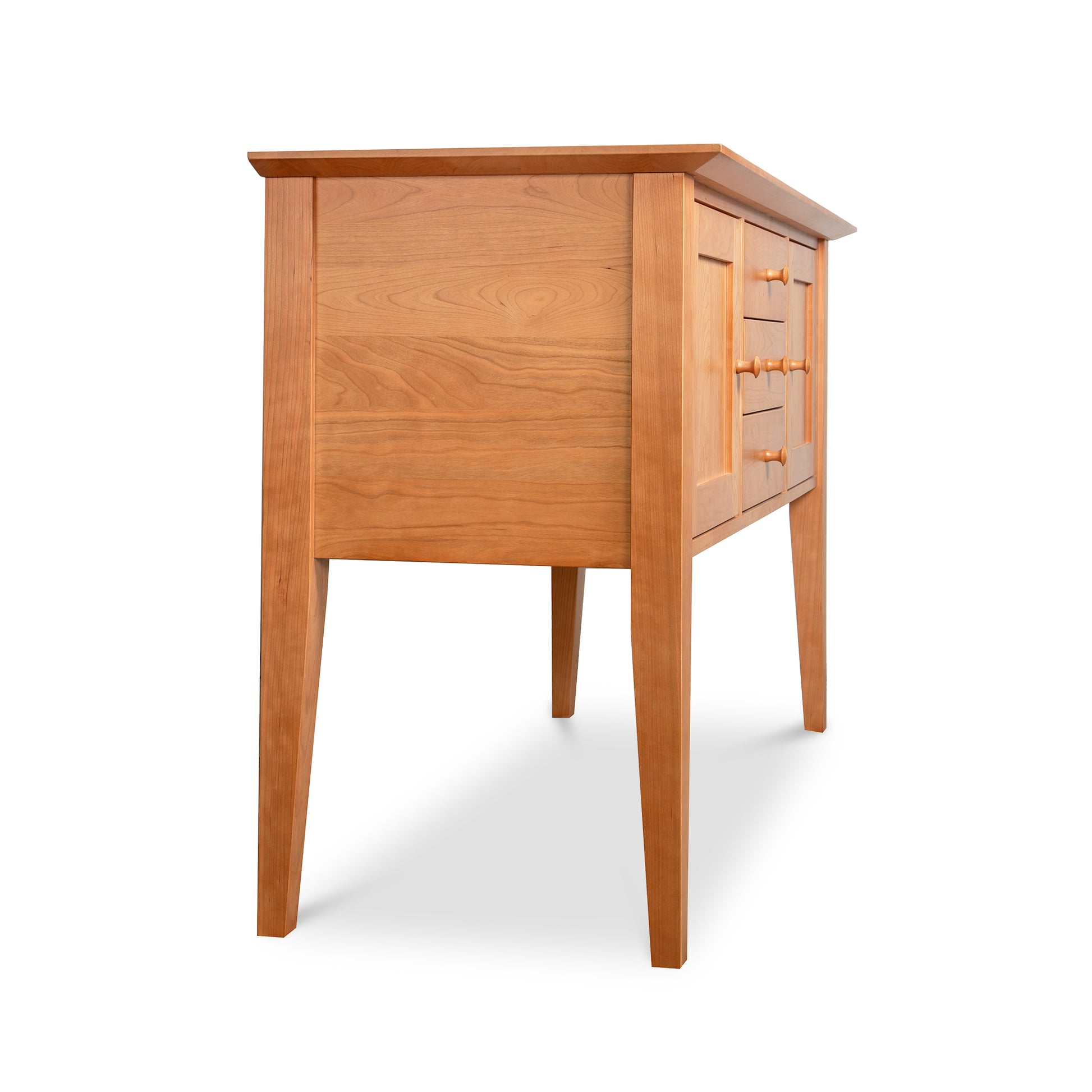 Classic Shaker Small Buffet by Lyndon Furniture with tapered legs and paneled sides, angled to highlight craftsmanship and detail.
