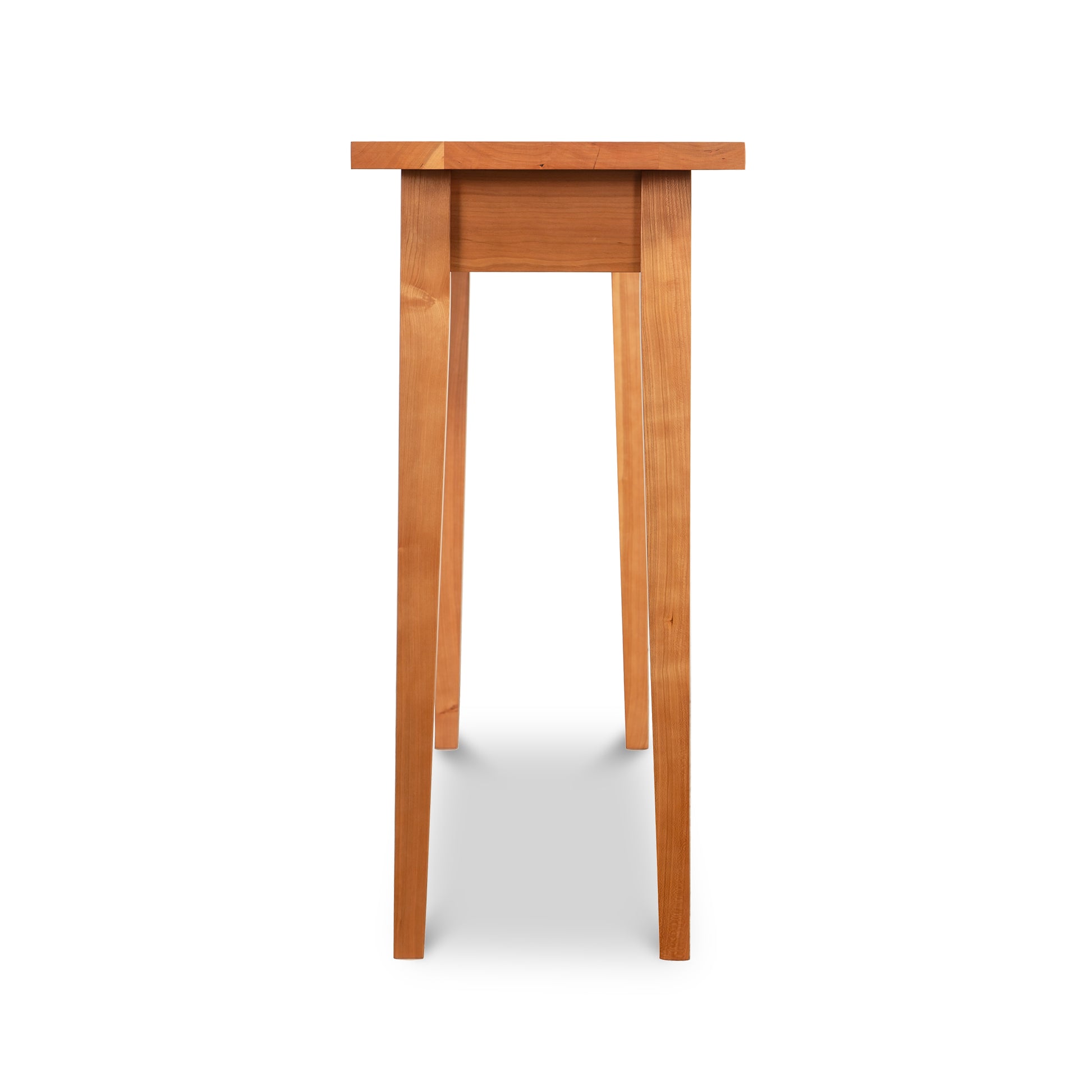 Lyndon Furniture Classic Shaker Sofa Table in natural cherry with tapered legs, viewed from the narrow side.