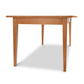 A luxury Classic Shaker Solid Boat Top table from Lyndon Furniture, featuring a wooden top and legs.