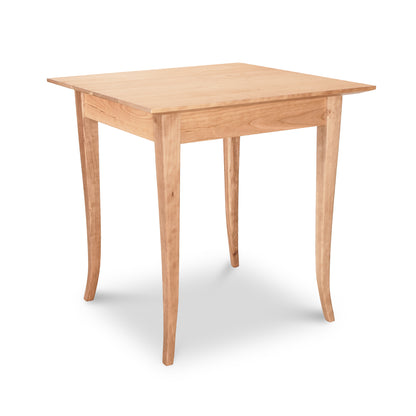 Lyndon Furniture Classic Shaker Flare Leg Square Solid Top Table made of solid hardwood with four distinctive flared legs and a square tabletop.