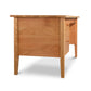 A Small Wood Executive Desk made by Lyndon Furniture with storage consisting of a drawer and two drawers.