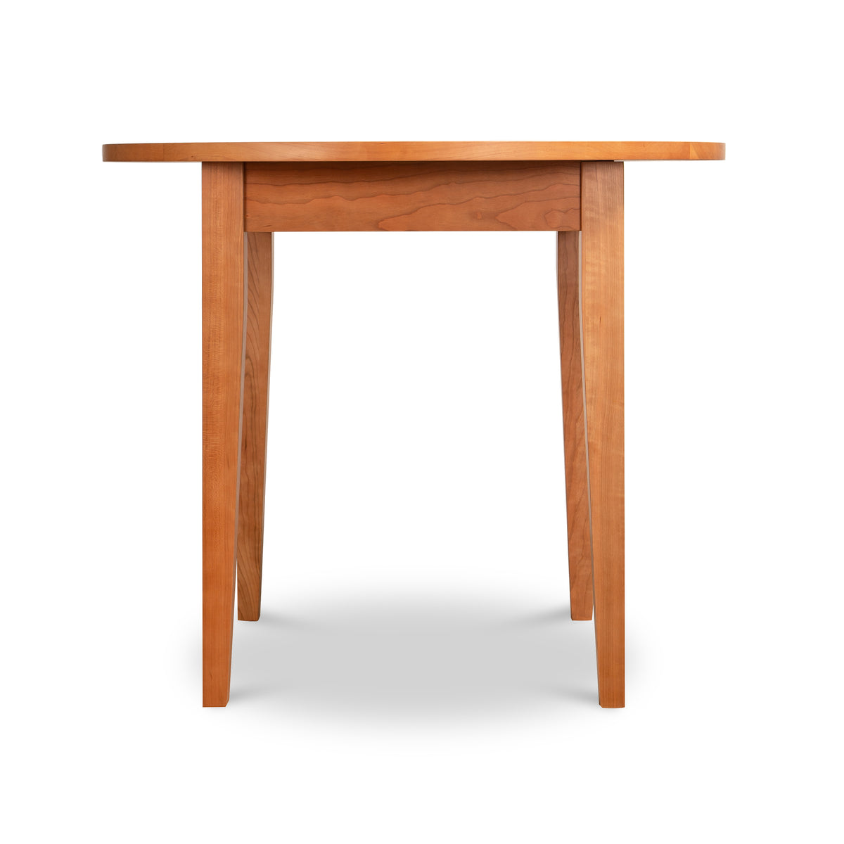 American-made solid hardwood Classic Shaker Round Dining Table featuring a smooth top and tapered legs.