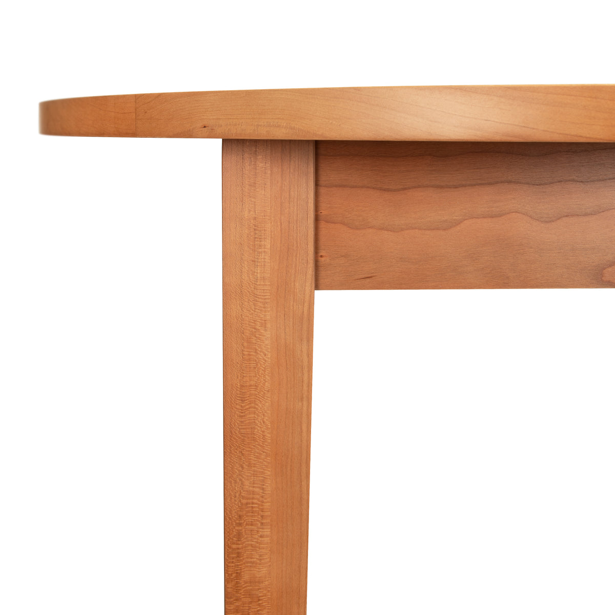 Classic Shaker Round Solid Top Dining Table featuring a rounded edge and tapered solid hardwood leg.